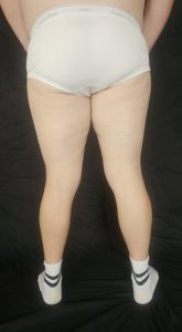 Joshua Marron facing backward, showing hips to feet in white briefs and socks for Project Legacy progress photo.