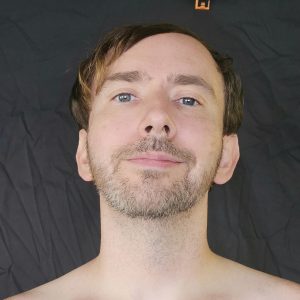 Close-up portrait of Joshua Marron’s face looking forward, for Project Legacy vegan fitness progress photos.