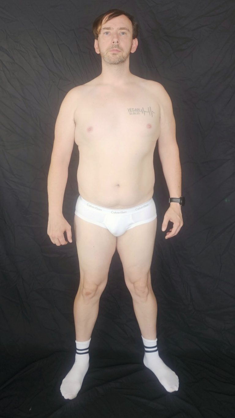 Joshua Marron standing facing forward in white briefs and socks, showing relaxed posture for Project Legacy body transformation progress.