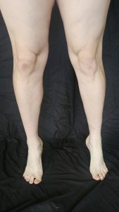 Joshua Marron standing on toes front view in white briefs for Project Legacy vegan fitness transformation photo.