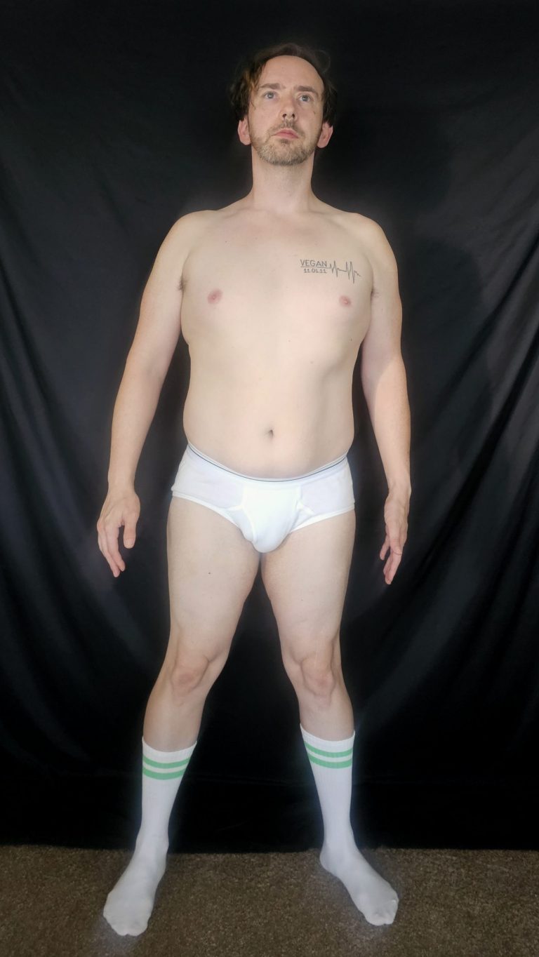 Joshua Marron front-facing Week 4 Project Legacy progress photo wearing white briefs and socks, documenting physical transformation.