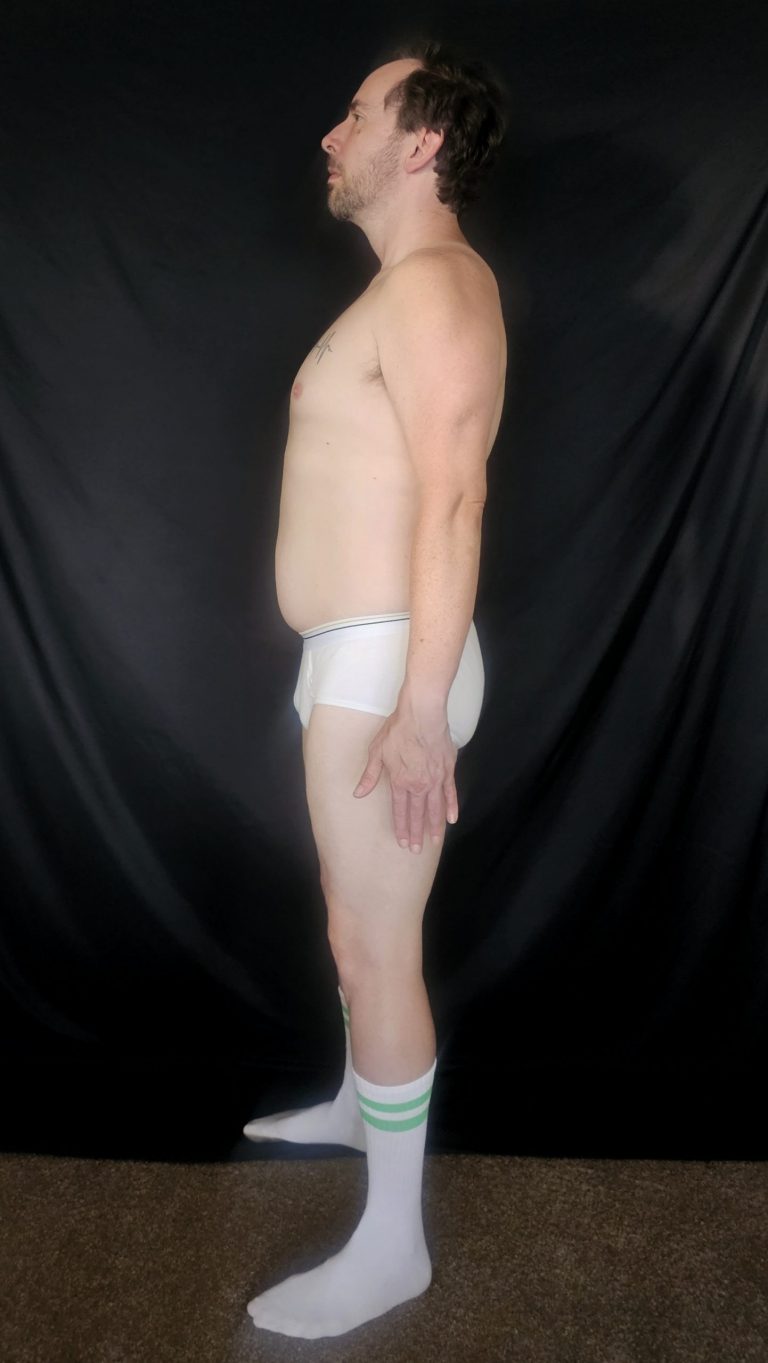 Joshua Marron left profile Week 4 Project Legacy progress photo, white briefs and socks, tracking body composition.