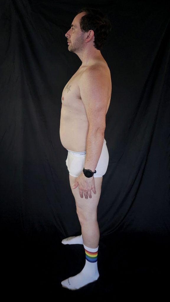 Left side profile of Joshua Marron in consistent check-in pose, revealing abdominal and leg shape at the Week 3 mark.