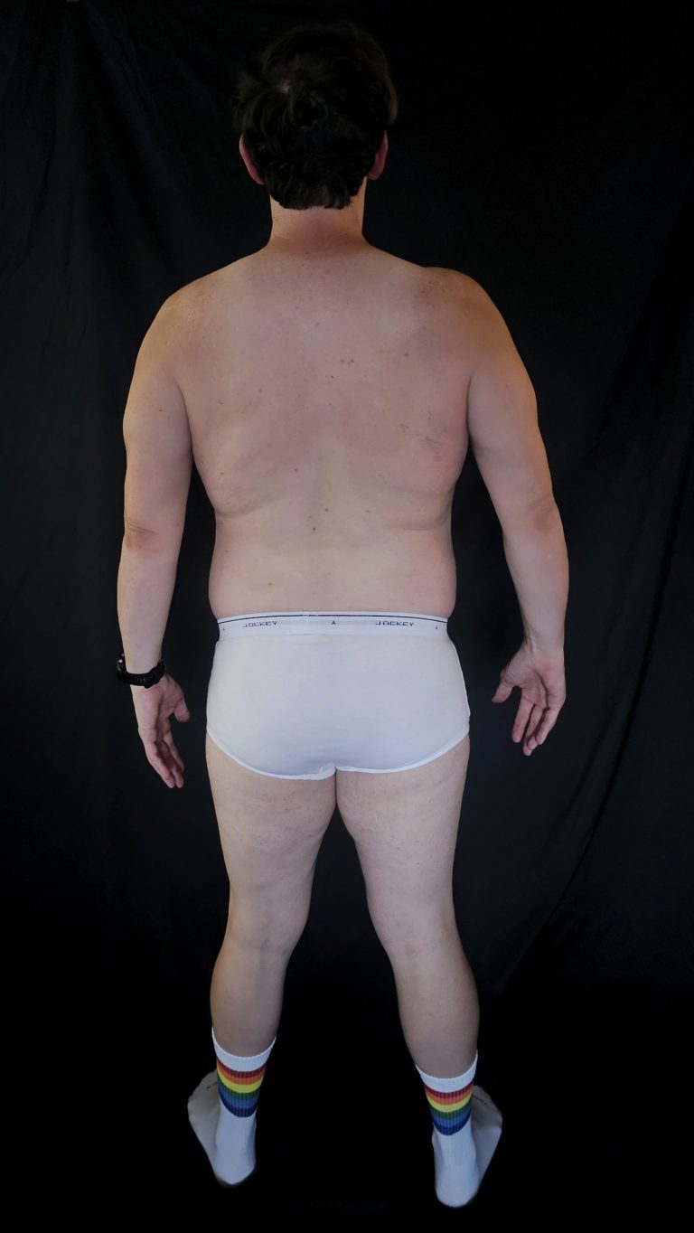 Rear-facing progress photo of Joshua Marron, showing shoulder and hamstring engagement during Week 3 of his transformation.