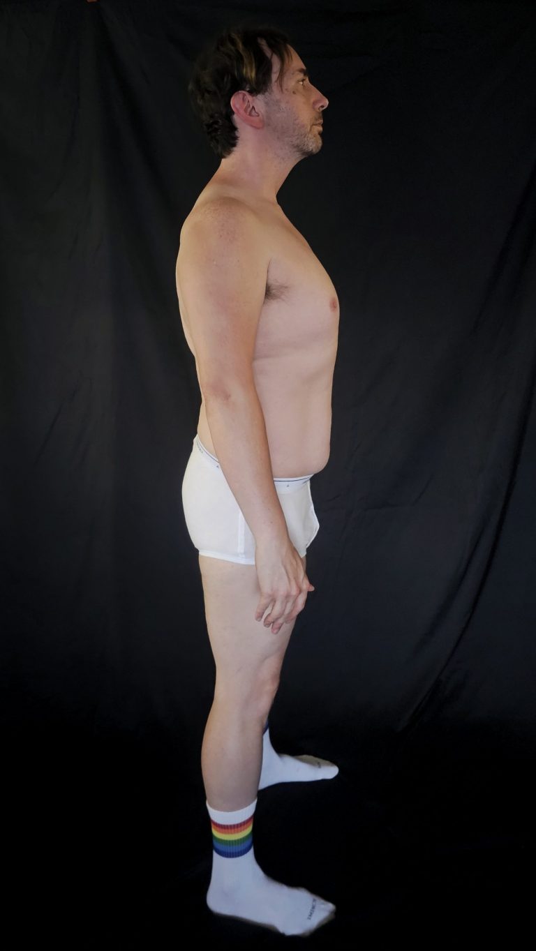 Right side profile of Joshua Marron in Project Legacy check-in attire, highlighting waist contour and posture alignment in Week 3.